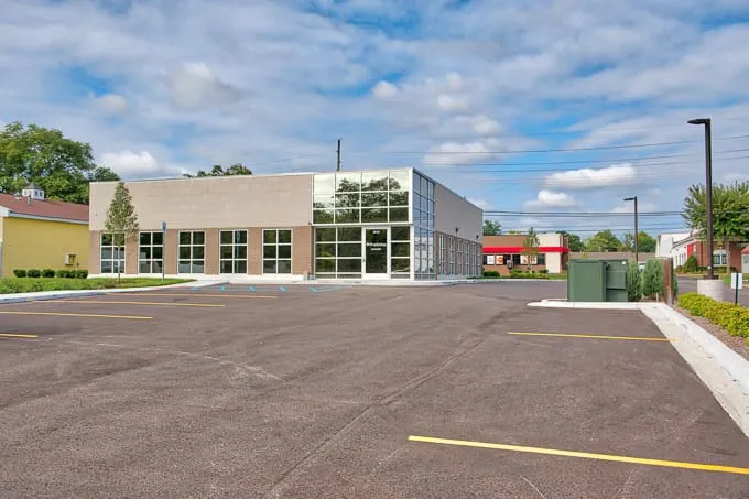 Wide view of the building and parking lot at Allergy & Asthma Physicians of Commerce Township in Commerce Township