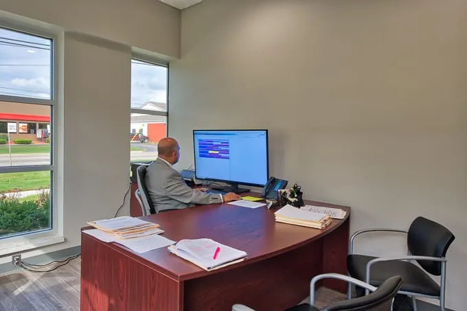 Dr. Pulin Patel working at his computer in his office at Allergy & Asthma Physicians of Commerce Township