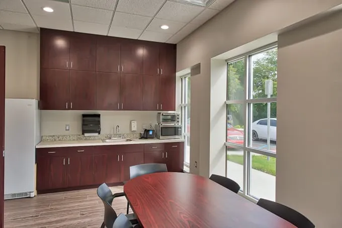 Staff break room with kitchenette and table at Allergy & Asthma Physicians of Commerce Township